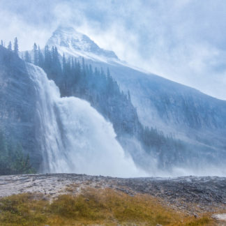 Emperor Falls in Mount Robson Provincial Park with Mount Robson in background on rainy day with heavy winds